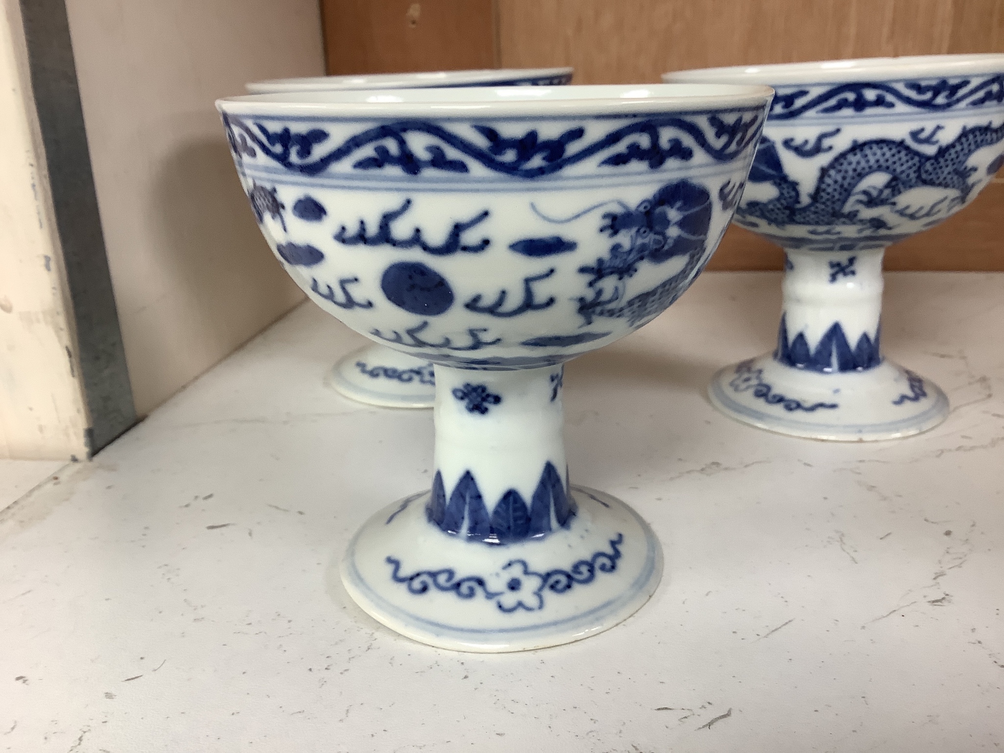 Three Chinese blue and white porcelain stem cups, c.1900, 9.5cm